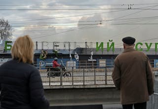 Residents stand near the site of a Russian drone strike in Ternopil, Ukraine